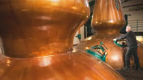 Getty Images worker at whisky distillery