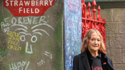 PA Media John Lennon's sister Julia Baird outside Strawberry Field