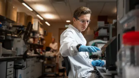 PA/University of Oxford Researcher in a laboratory at Oxford’s Jenner Institute working on the coronavirus vaccine developed by AstraZeneca and Oxford University, December 2020