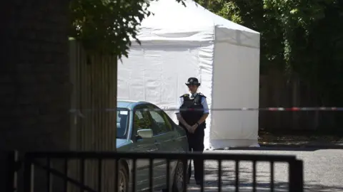 Kirsty O'Connor/PA Wire Forensic tent