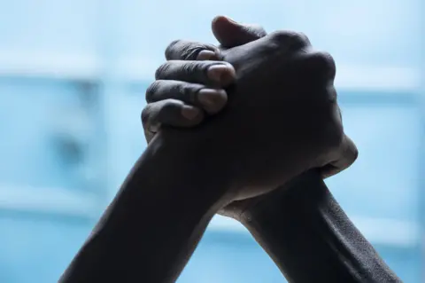 BBC United against violence: Edward and James hold hands