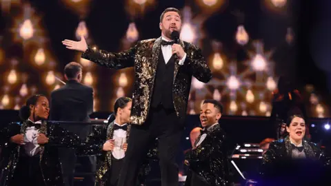 Getty Images Jason Manford and dancers on stage