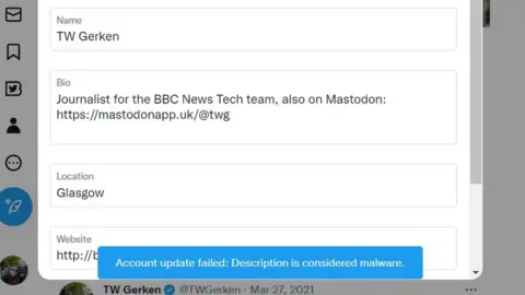 A screenshot from Twitter. It shows a Mastodon link in the Bio field of an account. At the bottom, it reads, "account update failed, description is considered malware".