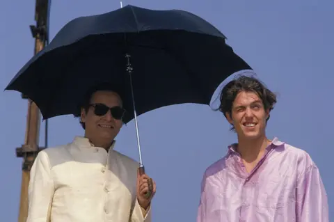 Getty Images Soumitra Chatterjee with Hugh Grant