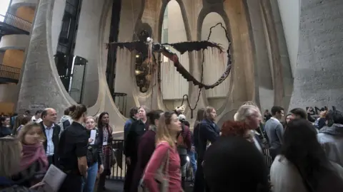 AFP Visitors walk past a sculpture by South African artist Nicholas Hlobo in the main hall of the Zeitz Museum of Contemporary African Art in Cape Town on September 22, 2017. Africa's largest museum dedicated to the continent's contemporary art opened to the public in Cape Town on September 22, becoming the region's most significant new cultural space in decades.