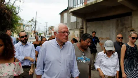 Getty Images Bernie Sanders tours hurricane-ravaged Puerto Rico.