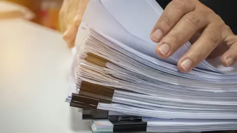 Getty Images Piles of documents