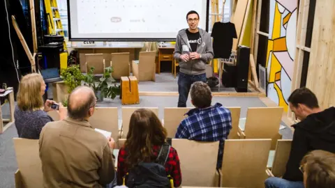 Mark A Phillips Ugo Vallauri giving a talk on repairing