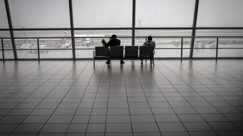 EPA Travellers at a near empty airport