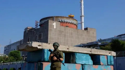 Reuters Russian soldier outside Zaporizhzhia nuclear plant in June 2023