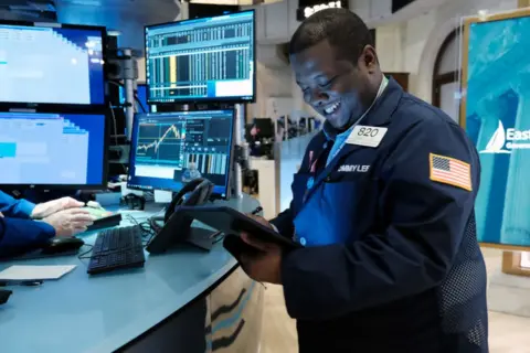 Getty Images Trader on the floor of the New York Stock Exchange.