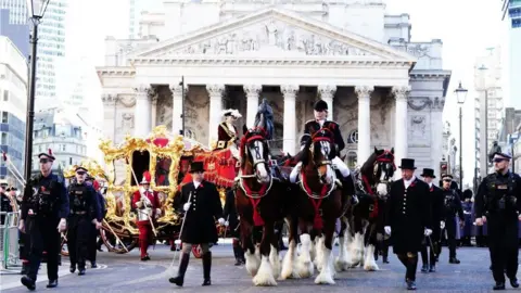 PA Media Michael Mainelli, the 695th Lord Mayor of the City of London, in the State Coach during the Lord Mayor's Show