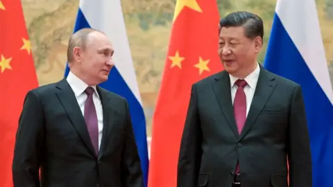 Alexei Druzhinin\TASS via Getty Images Russia's President Vladimir Putin (L) and his Chinese counterpart Xi Jinping pose during a meeting on 4 February