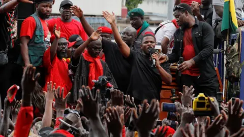 Reuters Ghana central bank governor asked to leave in mass street protest, in Accra 3 October 2023