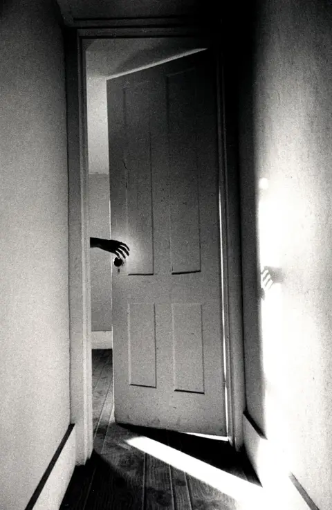 Ralph Gibson Hand in a doorway