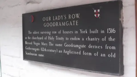 Robin Sones/Geograph Image of a sign on Goodramgate about the history of the building