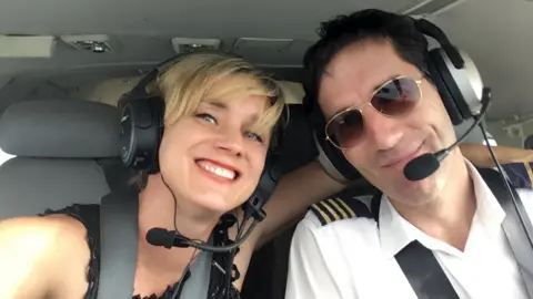 Jill Vine Bristol couple Jill and Greg Vine in plane cockpit.