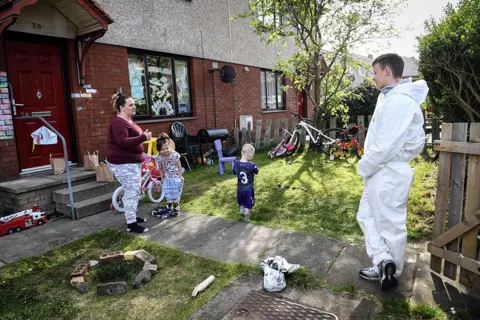 Andy Buchanan / AFP Social Bite social enterprise volunteer Russell Bowers delivers food