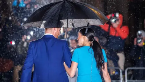 AFP/Getty Images Harry and Meghan at the awards