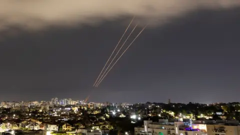 Reuters View of Ashkelon in Israel showing anti-missile system aiming at the sky after Iran launched drones and missiles towards Israel.