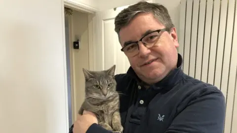 Cats Protection/PA Media Sir Robert Buckland