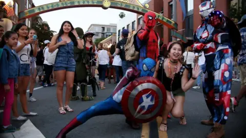 Getty Images Cosplay characters pose for pictures along 5th Avenue in the Gaslamp Quarter during Comic Con International on July 20, 2017 in San Diego, California