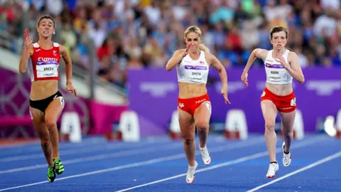 PA Media Olivia Breen winning the 100m T37/38 final