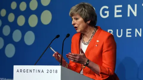 Getty Images Theresa May has sought to reassure world leaders that her Brexit deal is "good for the global economy".