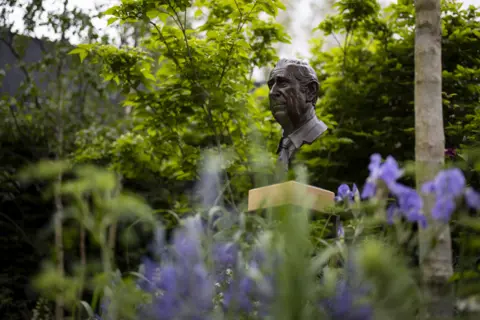 EPA A bronze head of Britain's King Charles III installed as Part of the RHS Garden of Royal Reflection and Celebration designed by Dave Green to celebrate Britain's King Charles III's coronation, at Chelsea Flower Show in London, Britain, 22 May 2023.