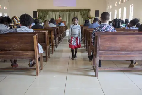Kerstin Hacker A girl attends a Baptist church service