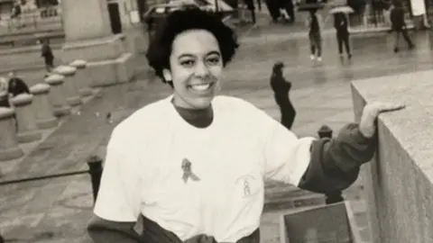 Michelle Clayford Black and white photo of Michelle Clayford in Trafalgar Square, London