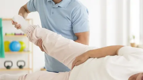 Getty Images Someone receiving physio