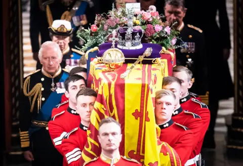 PA Media On top of Her Majesty's coffin was a wreath, the Imperial State Crown, and the Sovereign's orb and sceptre