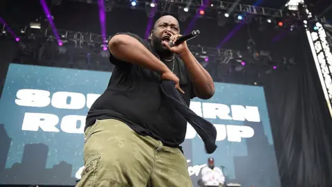 Getty Images Image shows Killer Mike on stage in 2014