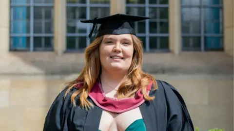 University of Bristol Chloe Fussell smiling wearing her graduation mortar board