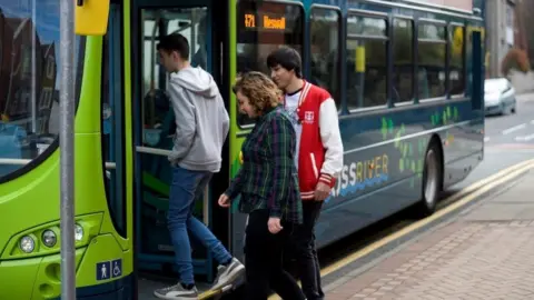 Transport Focus Young people boarding a bus