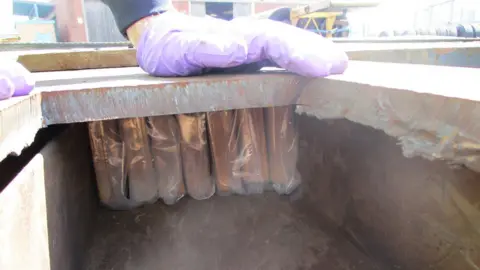 Greater Manchester Police Drugs hidden in trailer