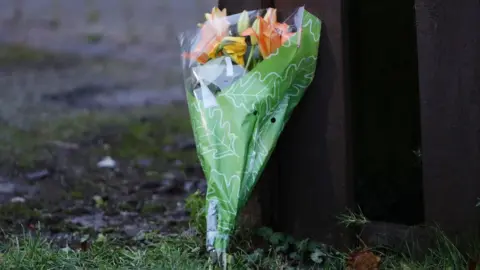 Arron Chown/PA Floral tribute