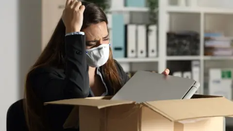 Getty Images Woman packing work items