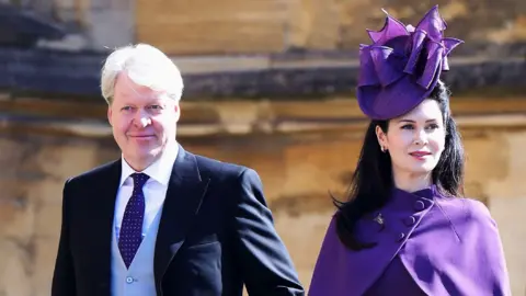 Getty Images Earl Spencer and his wife, Karen, at the wedding of Prince Harry and Meghan Markle, May 2018