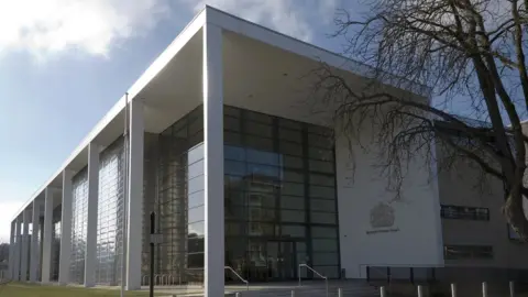 The exterior of Ipswich Crown Court on a bright, sunny day