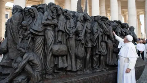 EPA Pope Francis inspects the sculpture in St. Peter's Square