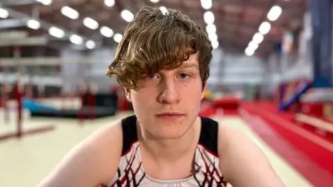 Martin Giles/BBC Simon competes at Waveney Gymnastics Club