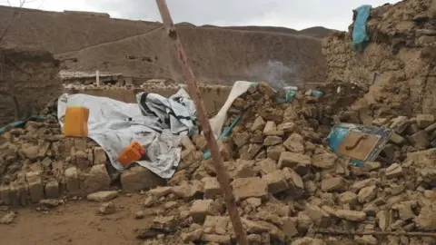 BAKHTAR NEWS AGENCY The rubble from buildings brought down by the quakes