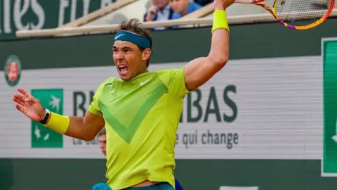 Getty Images Rafael Nadal of Spain plays a forehand against Felix Auger-Aliassime of Canada during the Men's Singles Fourth Round match on Day 8 of The 2022 French Open at Roland Garros on May 29, 2022