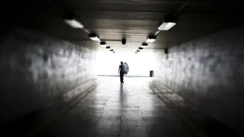 Getty Images Woman in underpass