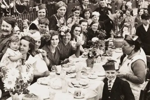 Getty Images A photograph of a street party in Battersea, London, held to celebrate the Coronation of King George VI 1937