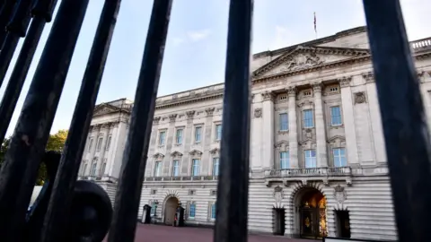 Buckingham Palace pictured through the gates