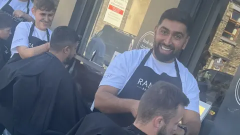 Ramson's Barbers working outside