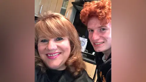 PA Media Jack Jenkins with his mum Joanne